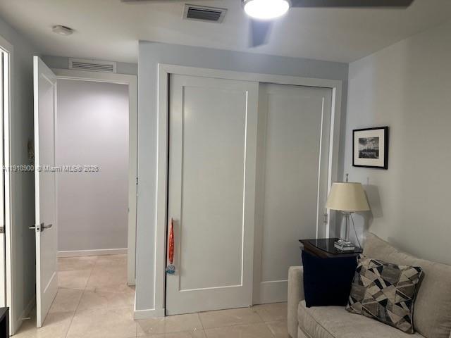 3089 Southwest 21st Street, Unit 3089 Miami, FL 33145 - Photo 8 of 15 a bedroom with a bed and a lamp