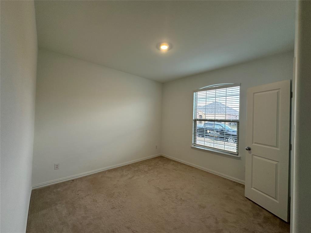 1462 Everett Gdns Way Forney, TX 75126 - Photo 13 of 14 Unfurnished room with light carpet and baseboards