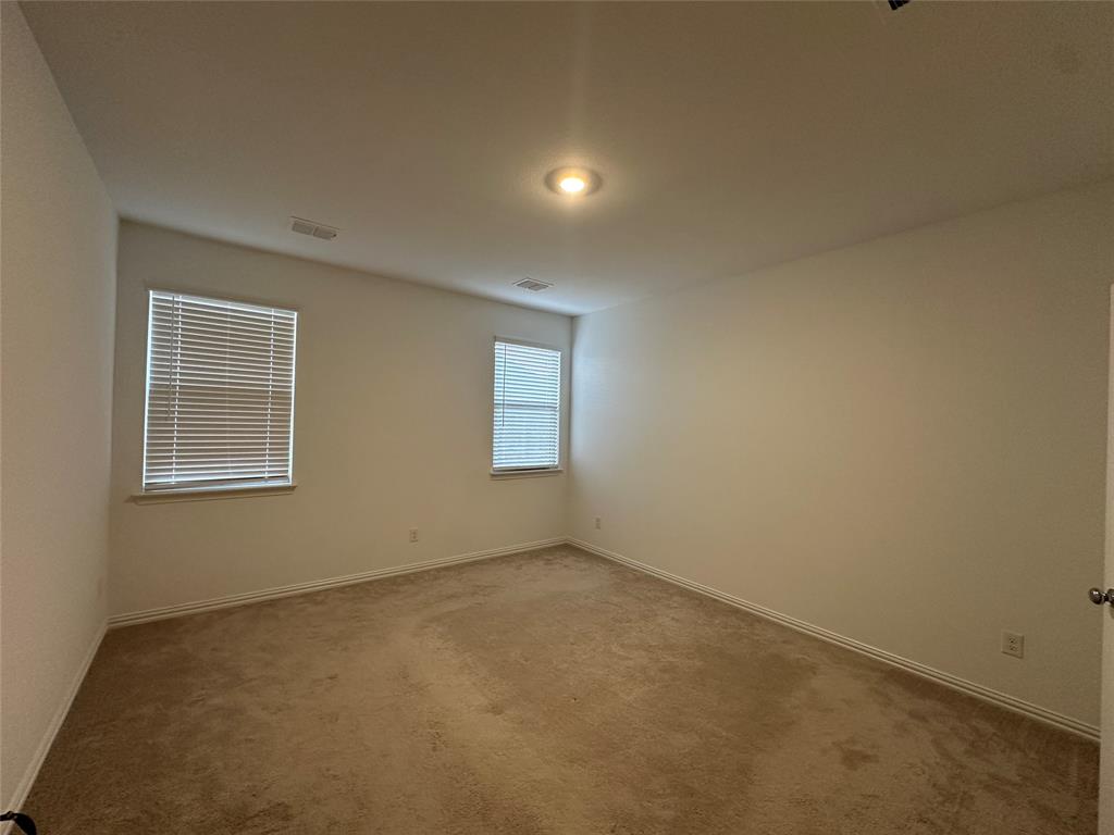1462 Everett Gdns Way Forney, TX 75126 - Photo 8 of 14 Unfurnished room featuring carpet floors and baseboards