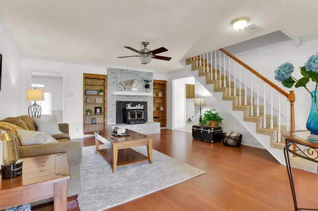 a living room with furniture fireplace and a chandelier
