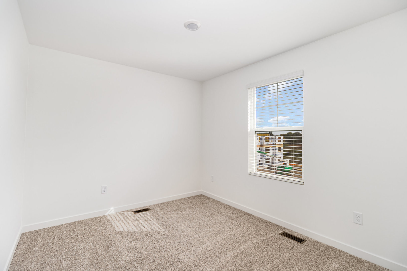 2171 Yellowstone Boulevard, Unit 2171 Mundelein, IL 60060 - Photo 15 of 23 an empty room with windows