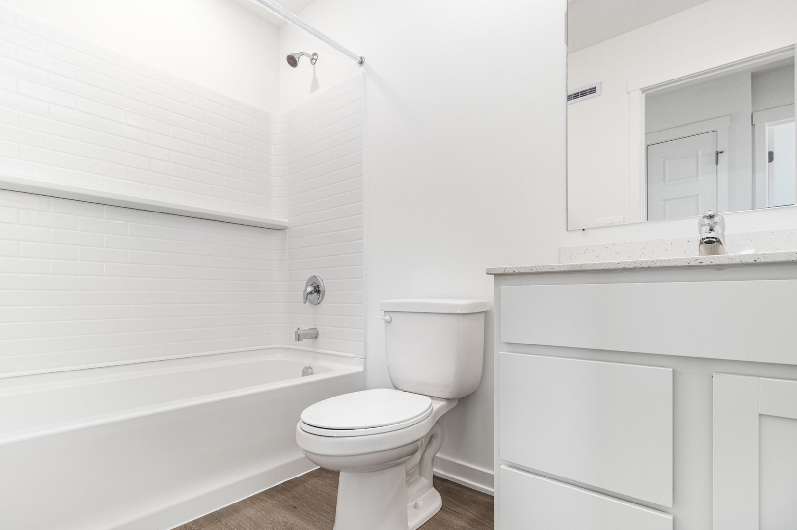 2171 Yellowstone Boulevard, Unit 2171 Mundelein, IL 60060 - Photo 17 of 23 a bathroom with a granite countertop sink mirror vanity and toilet