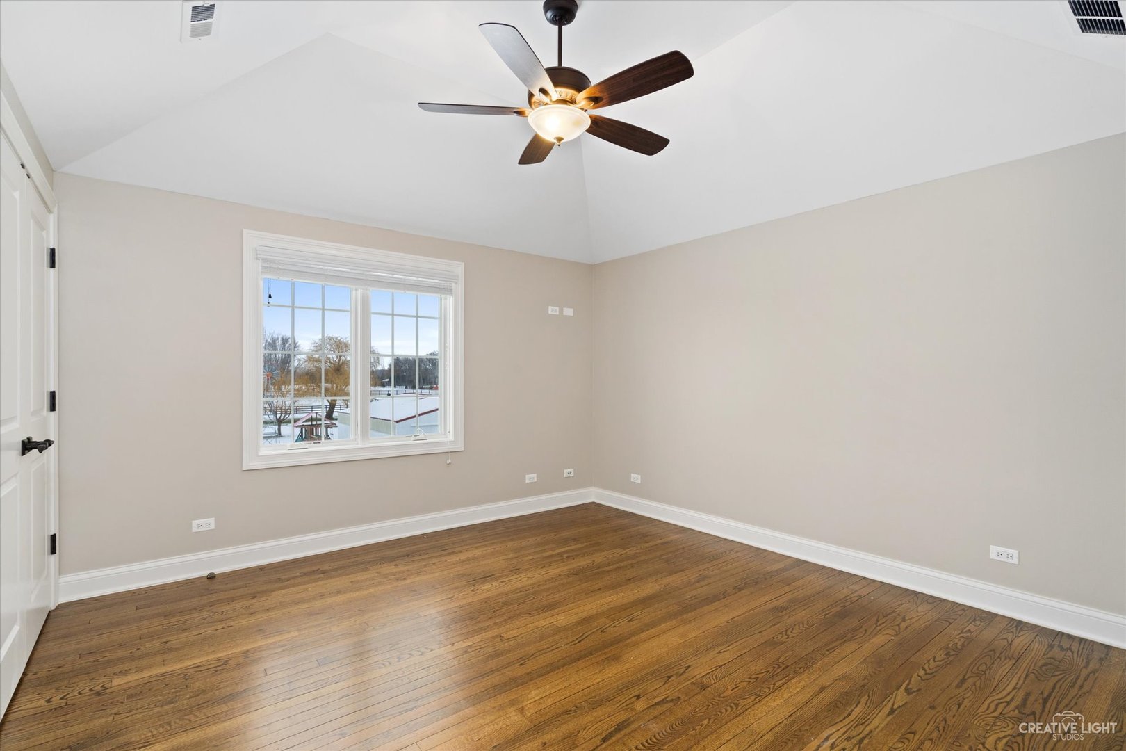 38W709 Seavey Road Batavia, IL 60510 - Photo 22 of 28 wooden floor in an empty room with a window