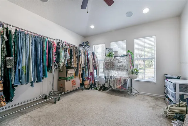 a view of room with furniture and windows