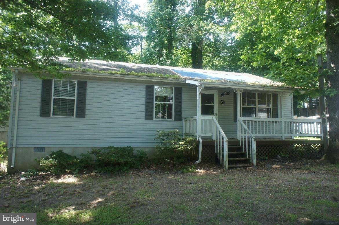 1109 Range Road Lusby, MD 20657 - Photo 1 of 11 a view of a house with a backyard