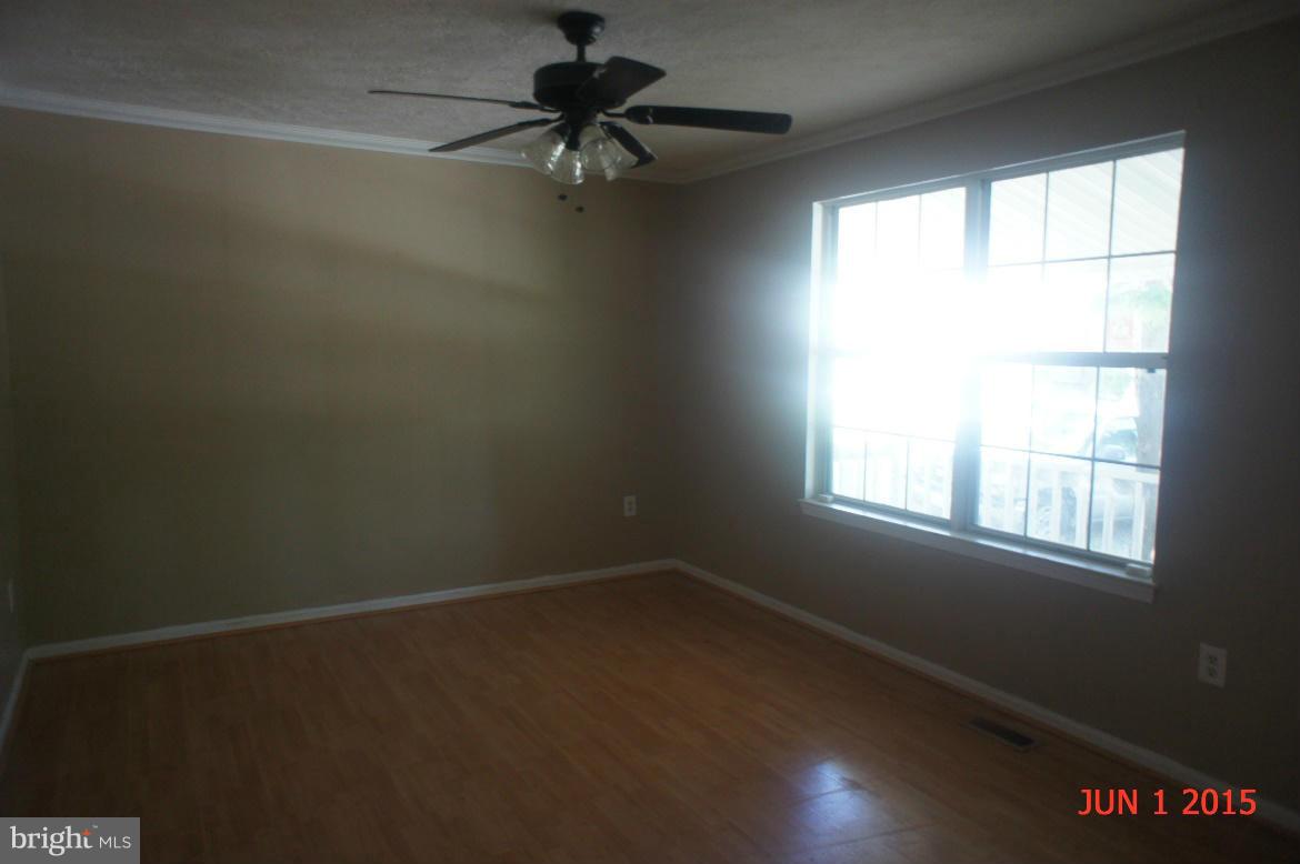 1109 Range Road Lusby, MD 20657 - Photo 4 of 11 an empty room with a window