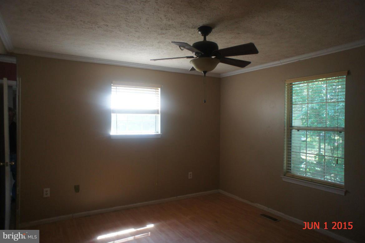 1109 Range Road Lusby, MD 20657 - Photo 7 of 11 a view of an empty room and window
