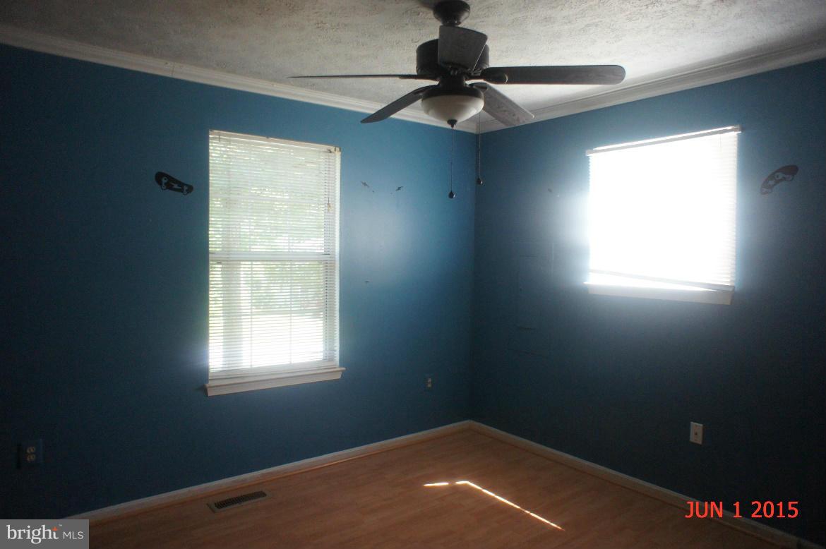 1109 Range Road Lusby, MD 20657 - Photo 9 of 11 an empty room with a window