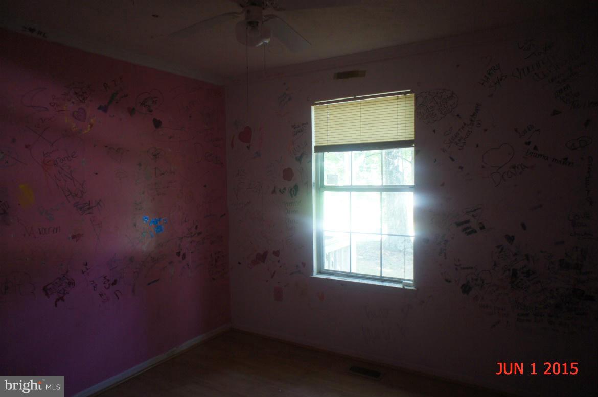 1109 Range Road Lusby, MD 20657 - Photo 10 of 11 an empty room with a window