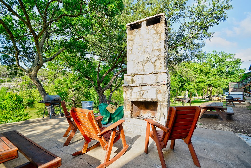 2960 Highway 39 Hunt, TX 78024 - Photo 17 of 23 a backyard of a house with table and chairs