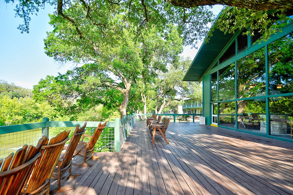 2960 Highway 39 Hunt, TX 78024 - Photo 21 of 23 a view of a patio with table and chairs and a large tree