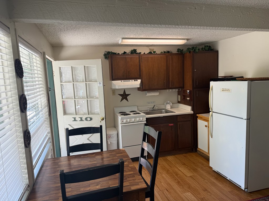 2960 Highway 39 Hunt, TX 78024 - Photo 10 of 23 a kitchen with a refrigerator and a stove top oven