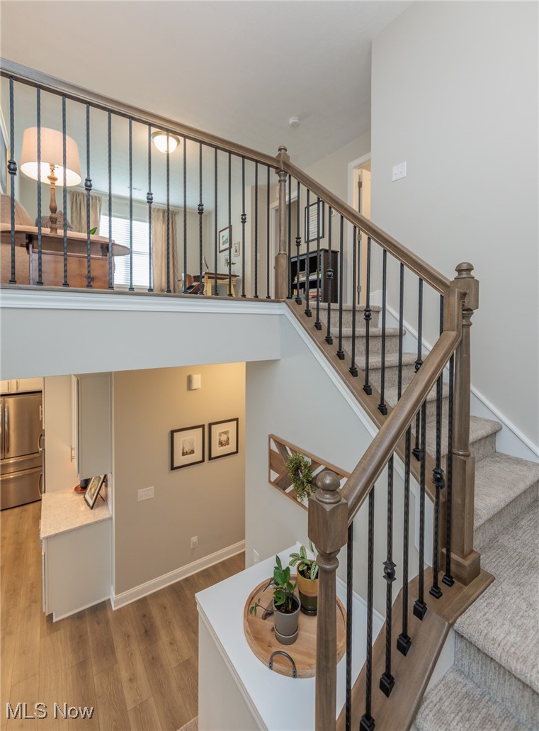 2041 Jaycox Road Avon, OH 44011 - Photo 38 of 50 Stairs featuring wood finished floors and baseboards