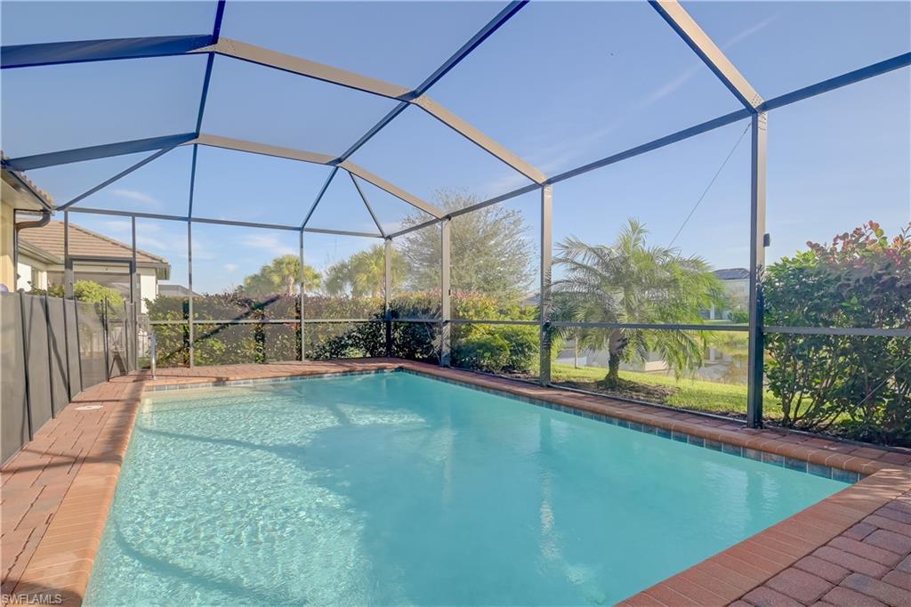 2076 Hamlin Street Naples, FL 34120 - Photo 20 of 24 a view of a backyard of a house