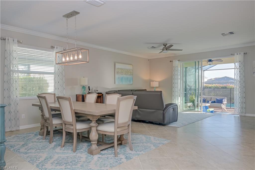 2076 Hamlin Street Naples, FL 34120 - Photo 2 of 24 a view of a livingroom with furniture window and wooden floor