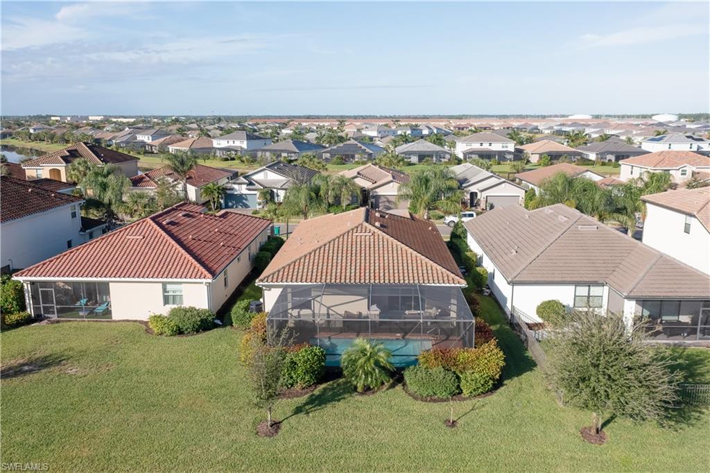 2076 Hamlin Street Naples, FL 34120 - Photo 23 of 24 an aerial view of multiple houses