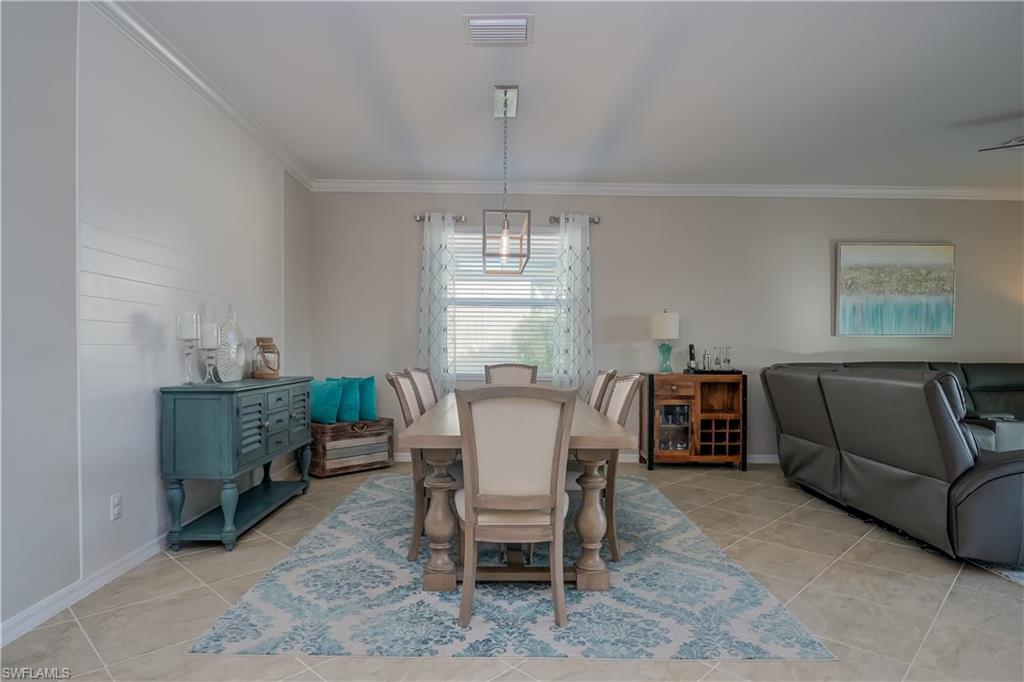 2076 Hamlin Street Naples, FL 34120 - Photo 3 of 24 a dining room with furniture and window