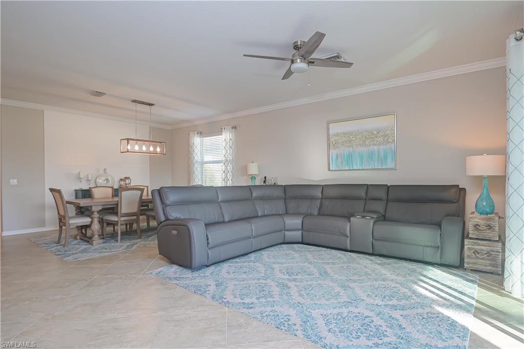 2076 Hamlin Street Naples, FL 34120 - Photo 4 of 24 a living room with furniture and a window