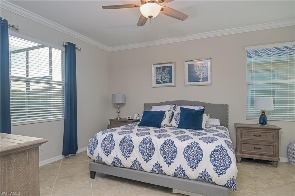 2076 Hamlin Street Naples, FL 34120 - Photo 9 of 24 a bedroom with a large bed and a window