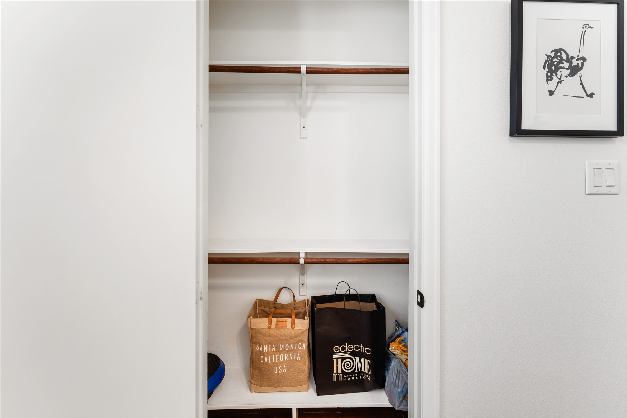 415 West 8th Street Houston, TX 77007 - Photo 33 of 39 Thoughtful storage is found throughout the home, including this generously sized secondary closet with ample shelving and hanging space. Designed to keep everything organized, it offers the functionality today's buyers appreciate. Every detail has been carefully considered to maximize everyday convenience.