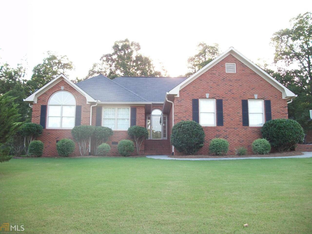 8 Limon Place Southwest Rome, GA 30165 - Photo 1 of 1 a front view of a house with a yard and garage