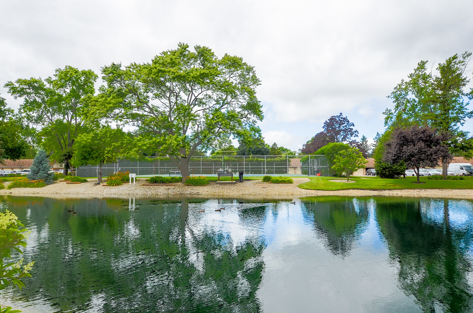 1206 South New Wilke Road, Unit 108 Arlington Heights, IL 60005 - Photo 19 of 21 a view of a lake view with a big yard