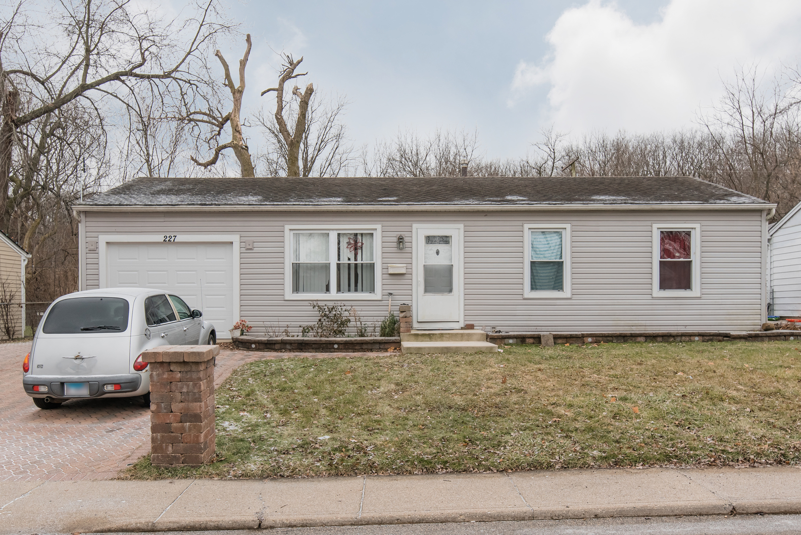 227 Rivers View Drive Carpentersville, IL 60110 - Photo 1 of 24 a house view with a garden space