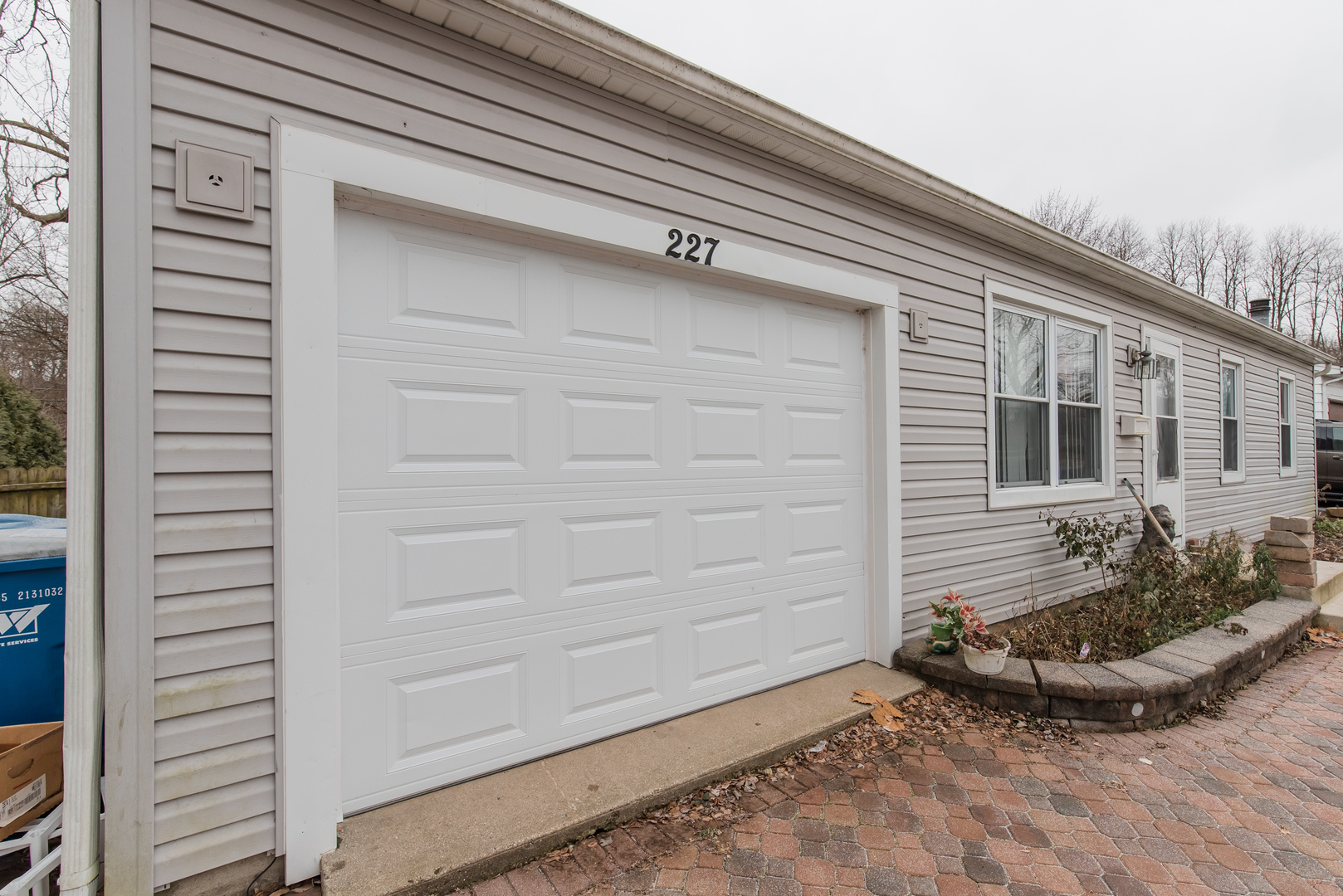 227 Rivers View Drive Carpentersville, IL 60110 - Photo 2 of 24 a view of a house with a small backyard