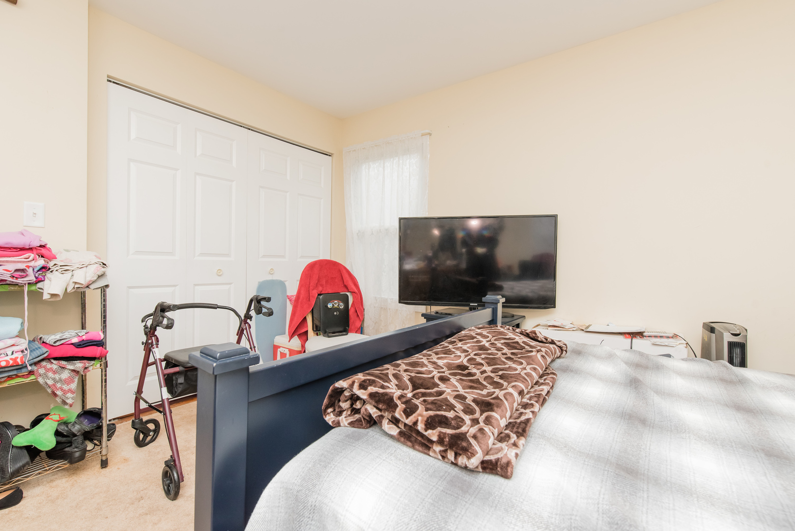 227 Rivers View Drive Carpentersville, IL 60110 - Photo 16 of 24 a bedroom with a bed and a flat screen tv