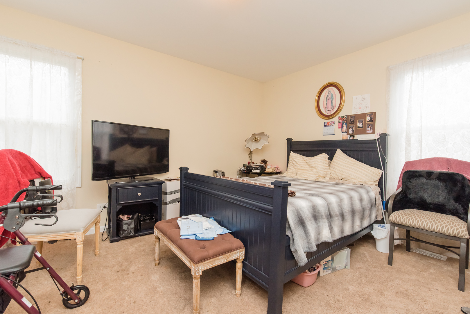 227 Rivers View Drive Carpentersville, IL 60110 - Photo 17 of 24 a bedroom with a bed and flat screen tv