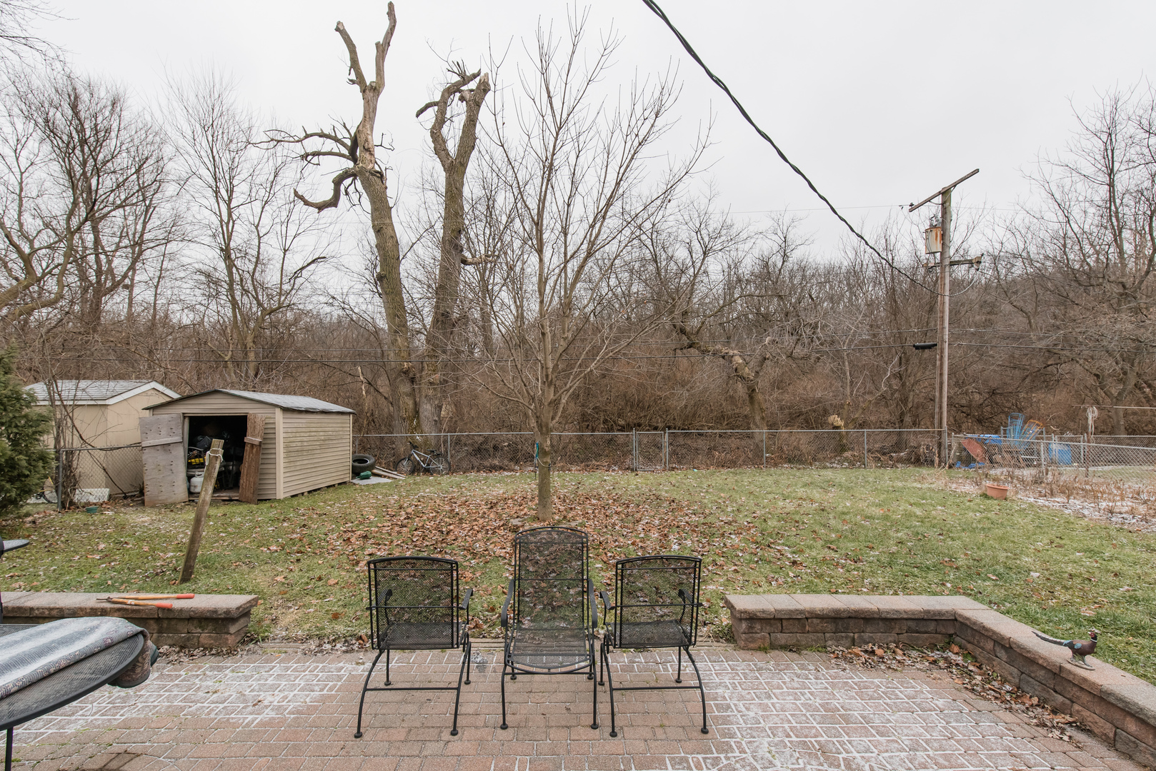 227 Rivers View Drive Carpentersville, IL 60110 - Photo 22 of 24 a backyard of a house with table and chairs