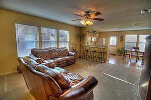 2620 Caprock Road McKinney, TX 75071 - Photo 4 of 19 Living area featuring carpet and ceiling fan