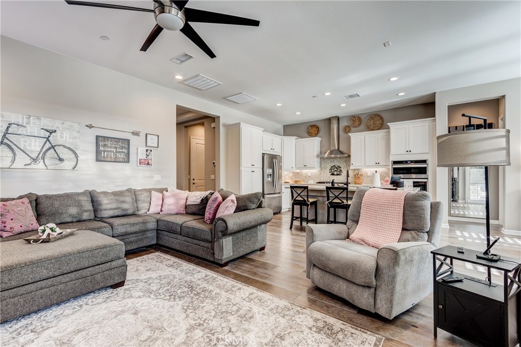 11137 Briar Rose Court Corona, CA 92883 - Photo 14 of 75 a living room with furniture and a view of kitchen