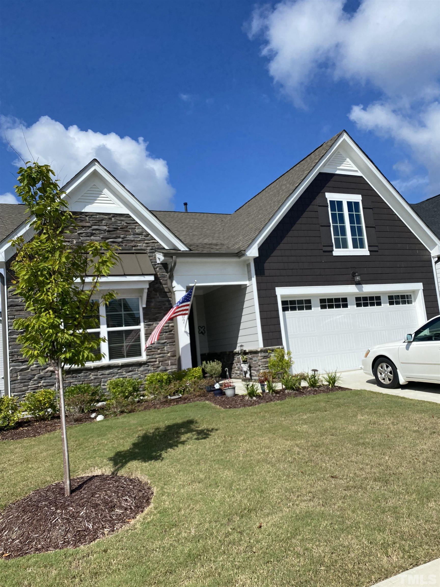 107 Ivory Lane Raleigh, NC 27610 - Photo 1 of 25 a front view of a house with a yard