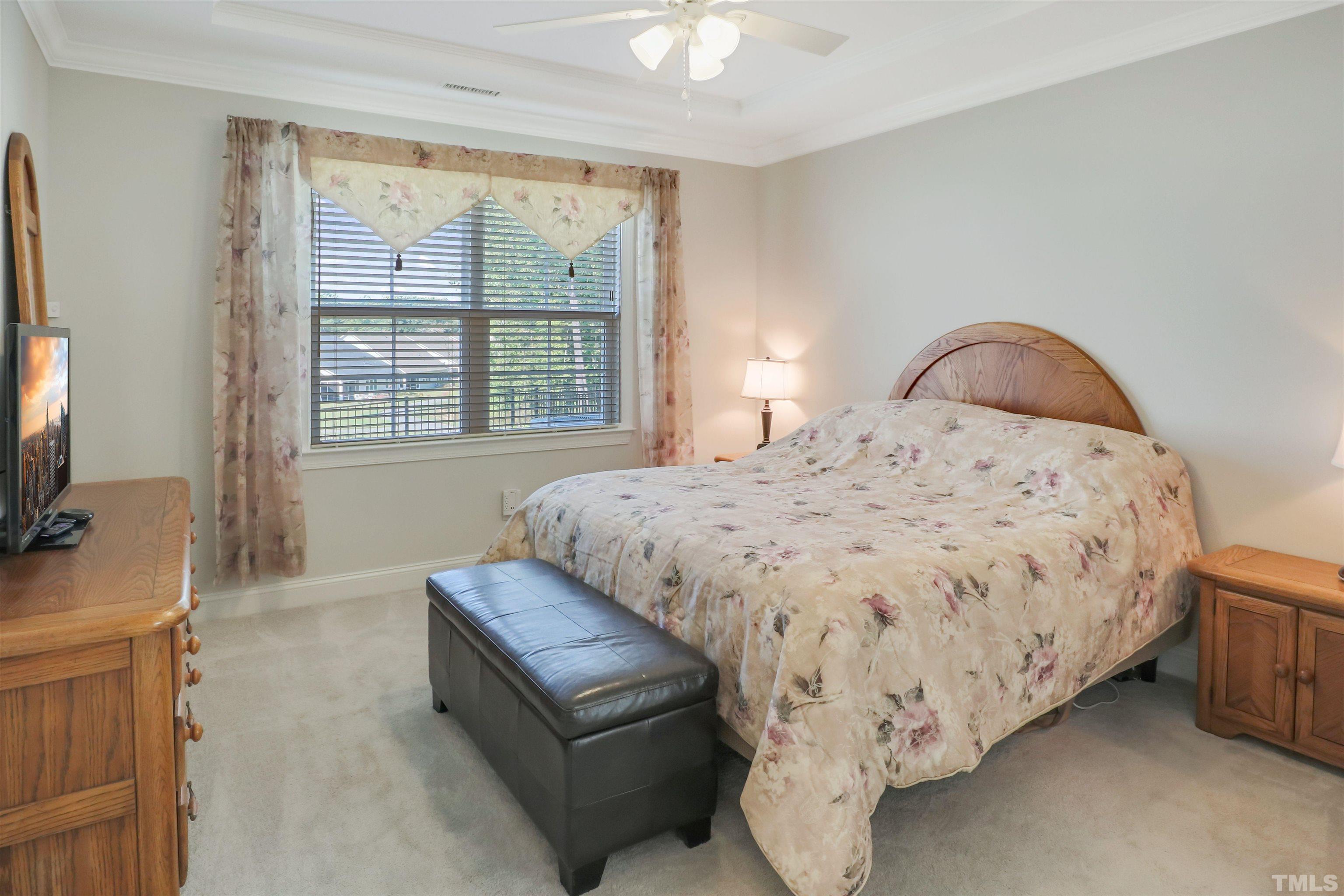 107 Ivory Lane Raleigh, NC 27610 - Photo 13 of 25 a bedroom with a bed and a flat screen tv