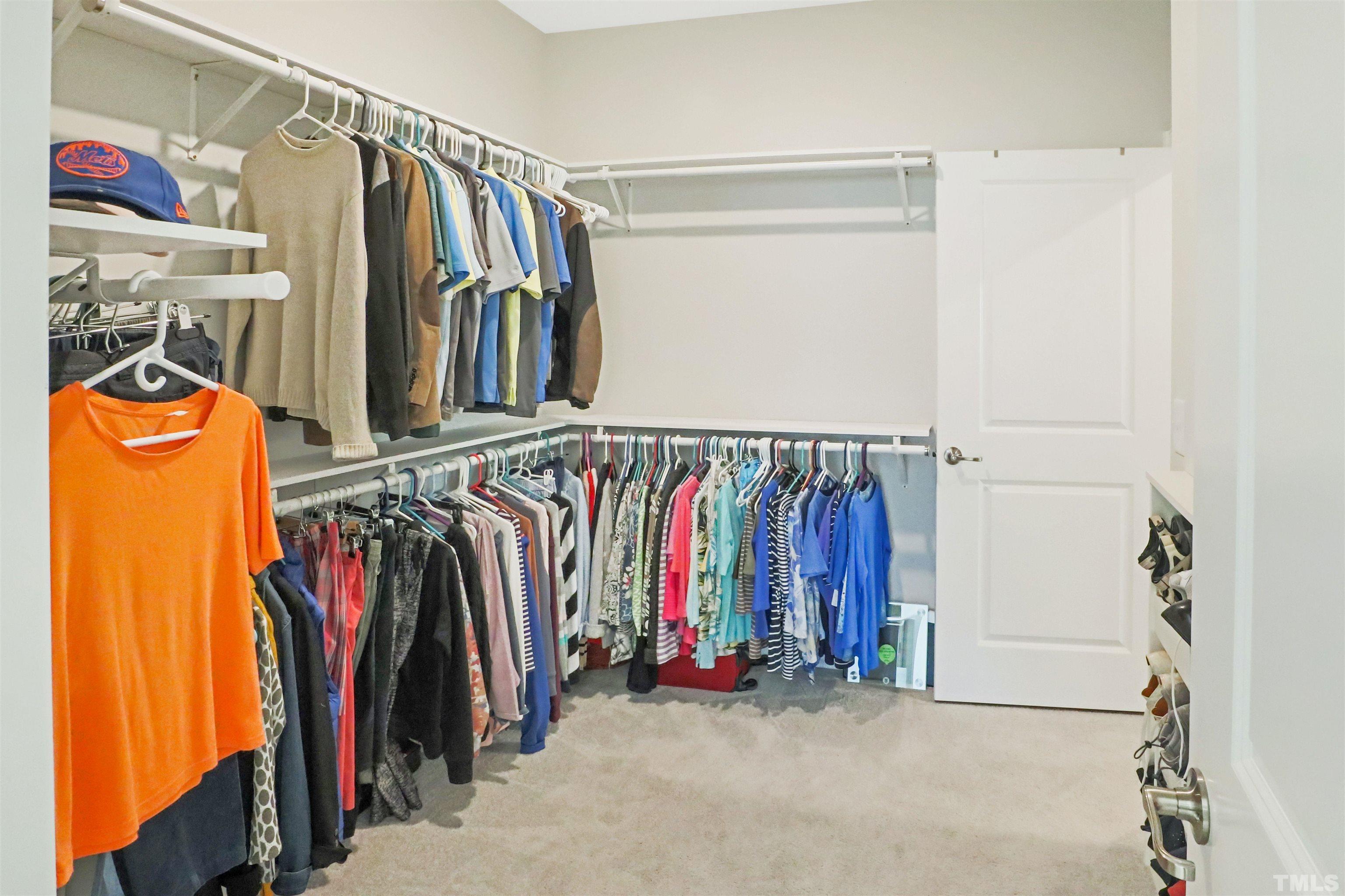 107 Ivory Lane Raleigh, NC 27610 - Photo 16 of 25 a view of walk in closet with clothes