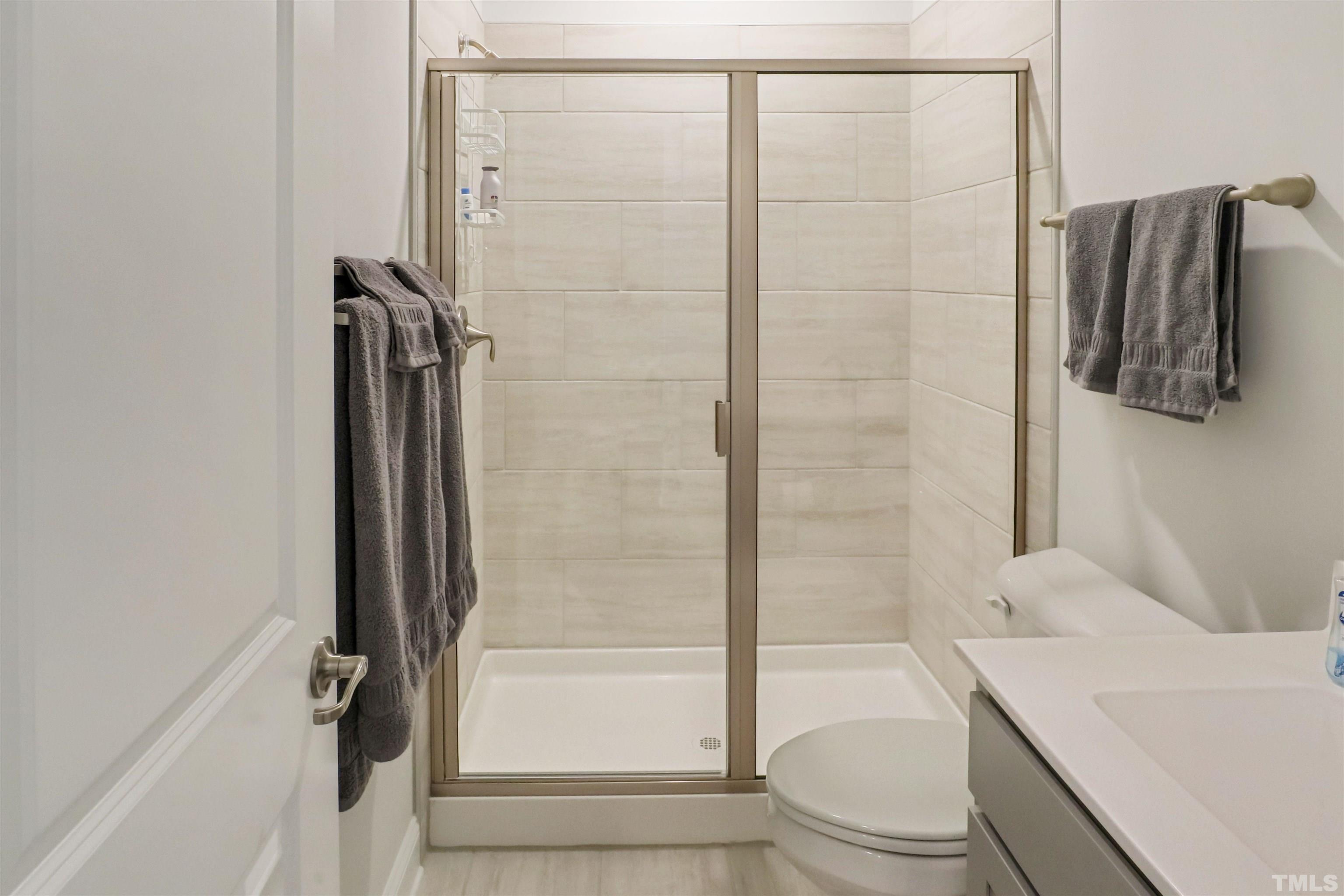 107 Ivory Lane Raleigh, NC 27610 - Photo 18 of 25 a bathroom with a shower and a sink