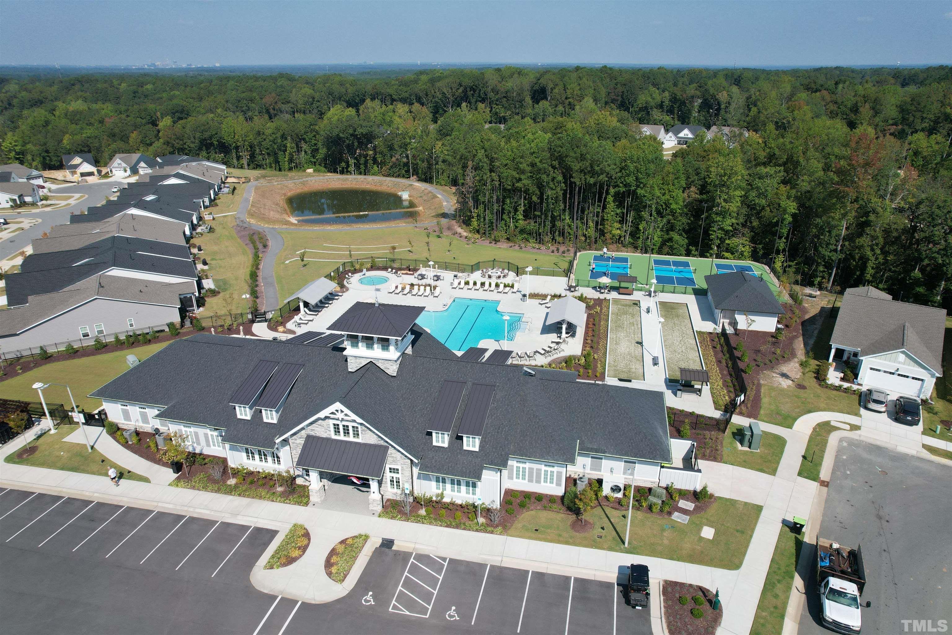 107 Ivory Lane Raleigh, NC 27610 - Photo 25 of 25 an aerial view of a house with garden space and patio