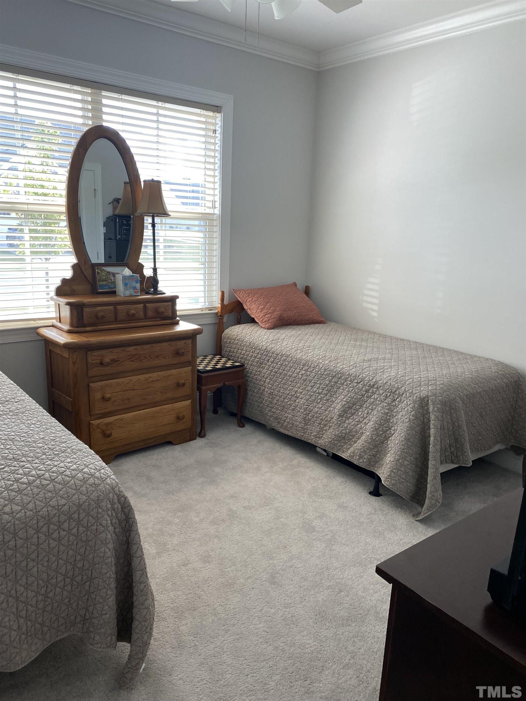 107 Ivory Lane Raleigh, NC 27610 - Photo 6 of 25 a bedroom with a bed and a dresser