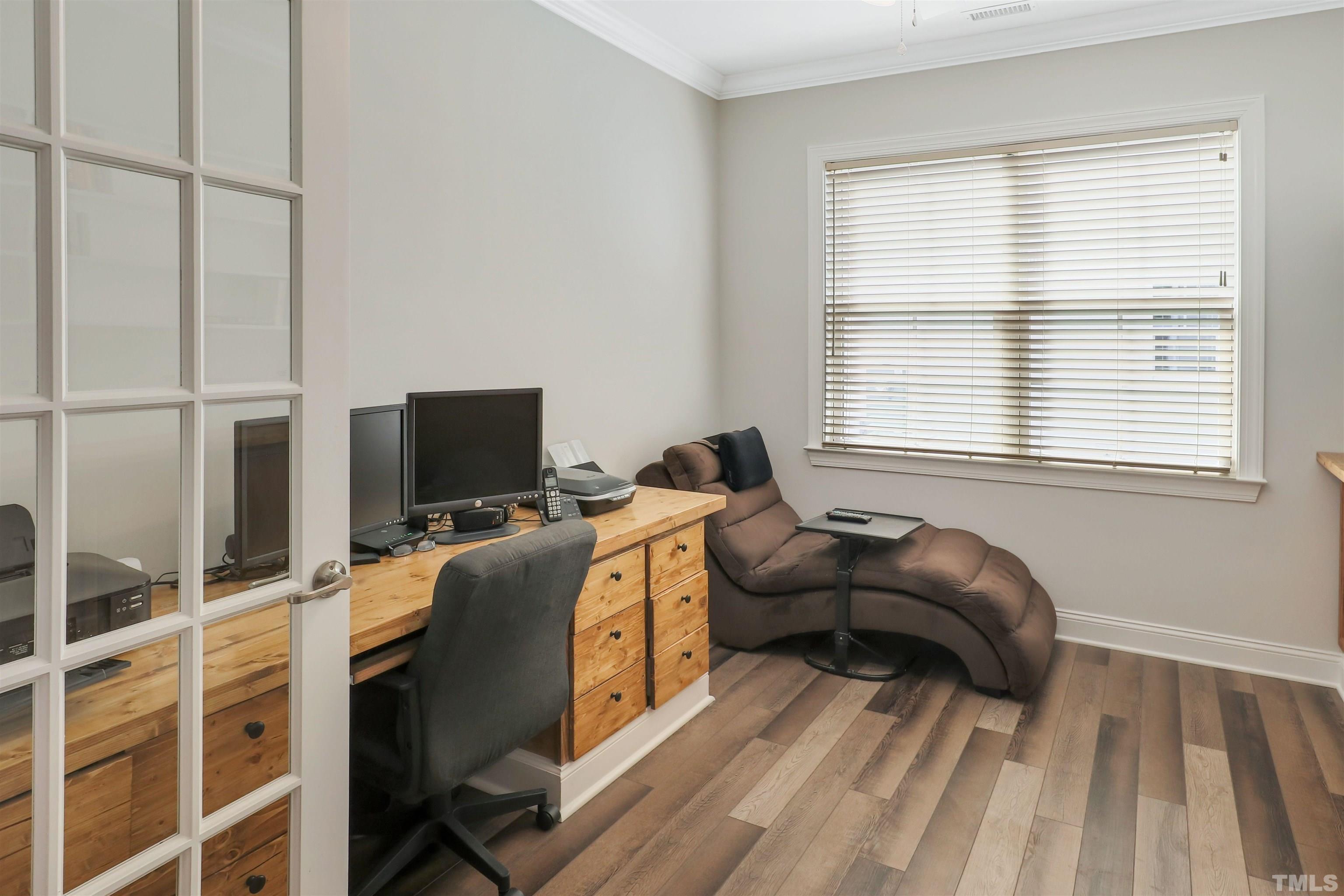 107 Ivory Lane Raleigh, NC 27610 - Photo 10 of 25 a bedroom with a bed and a flat screen tv