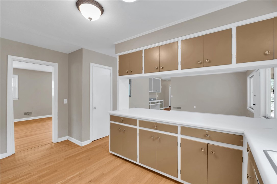 106 Mitchell Avenue Clemson, SC 29631 - Photo 11 of 31 This bright kitchen features ample cabinetry and a functional breakfast bar for everyday living.