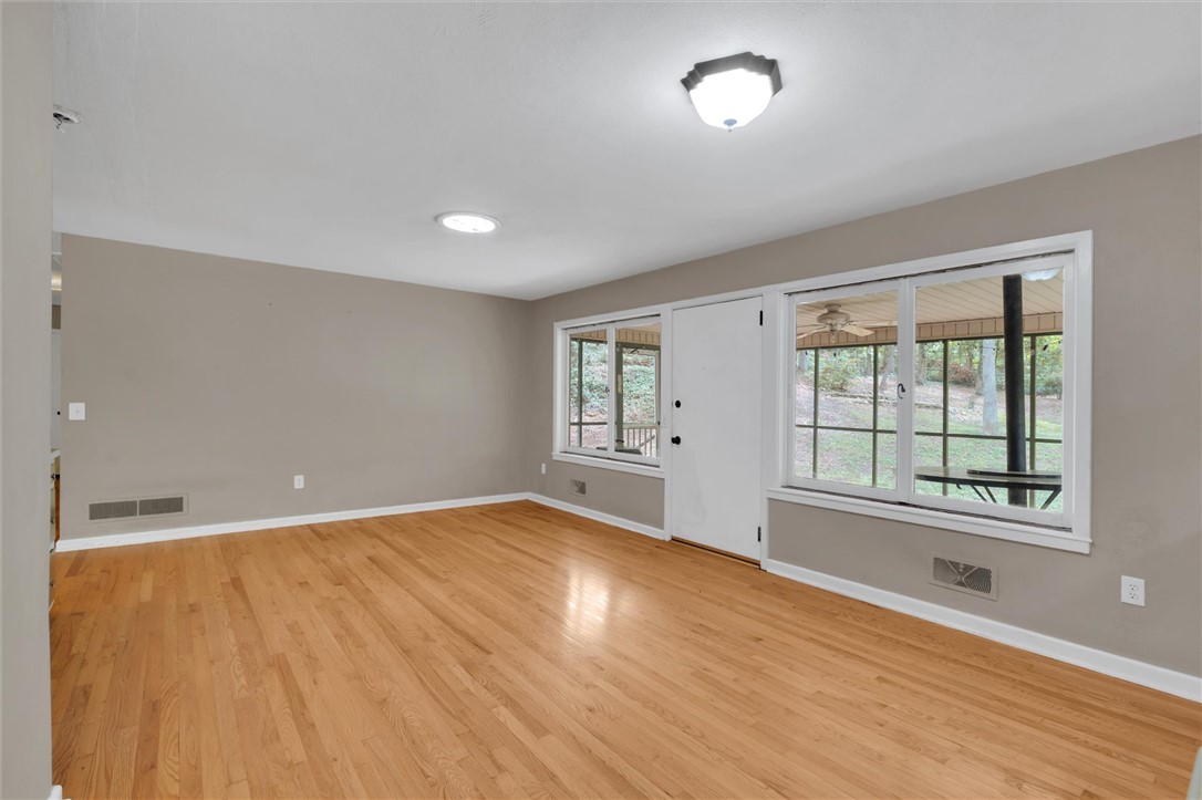 106 Mitchell Avenue Clemson, SC 29631 - Photo 13 of 31 Bright and airy, this inviting room features polished hardwood floors and abundant natural light.