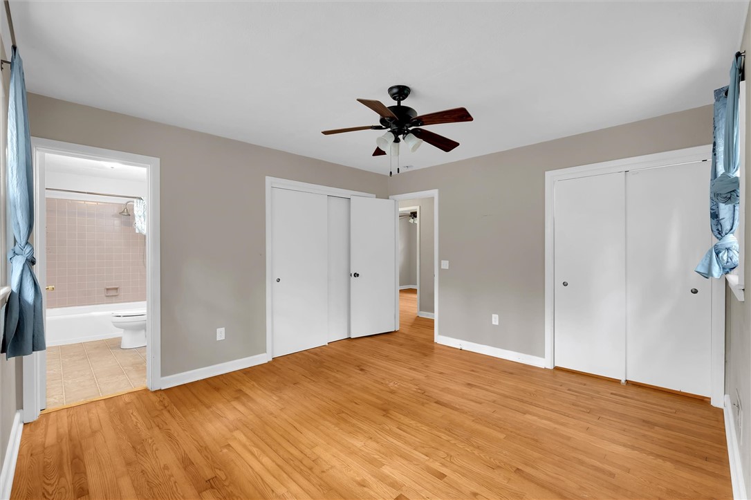106 Mitchell Avenue Clemson, SC 29631 - Photo 16 of 31 This spacious bedroom offers comfortable living with hardwood floors and ample closet space.
