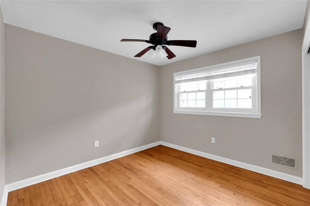 106 Mitchell Avenue Clemson, SC 29631 - Photo 20 of 31 This airy room features durable hardwood floors and ample natural light through its large window.