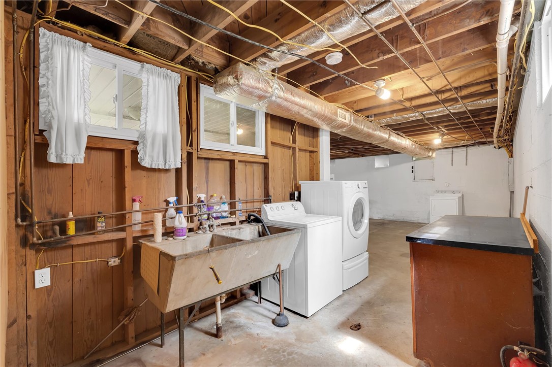 106 Mitchell Avenue Clemson, SC 29631 - Photo 21 of 31 This functional basement laundry area provides ample space and utility for household tasks.