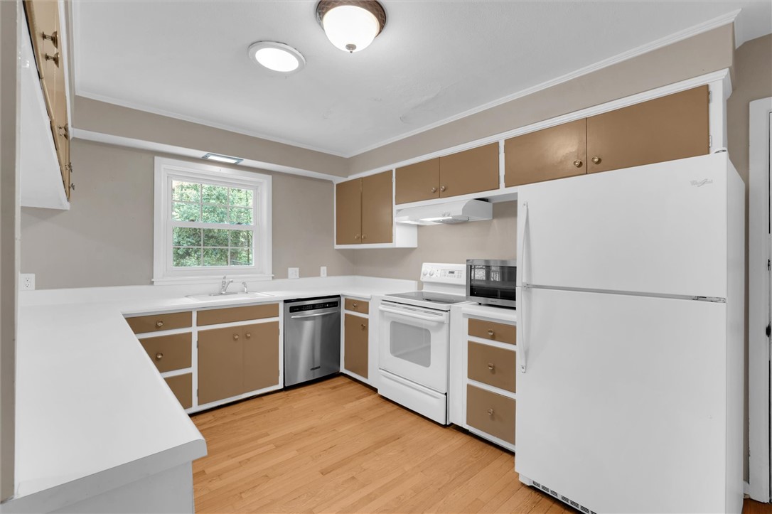 106 Mitchell Avenue Clemson, SC 29631 - Photo 9 of 31 This functional kitchen features ample cabinetry and a clean aesthetic.