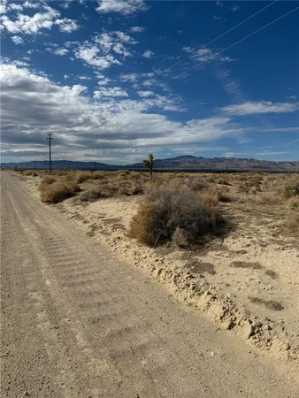 a view of a road with an ocean view