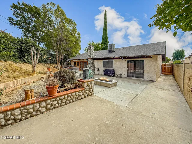 a house with trees in the background