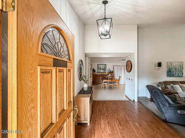 a view of a livingroom with furniture and wooden floor