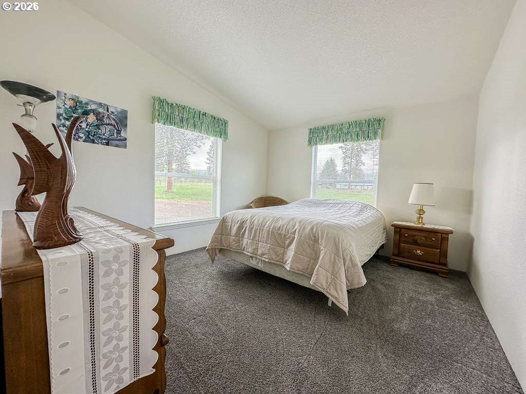 46198 Slaughterhouse Road Halfway, OR 97834 - Photo 21 of 40 a bedroom with a bed and a window